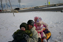 Sledding on a hill by our house