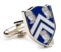 Blue rice University cuff links with owls.