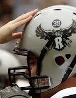 Silver Rice football helmet with owl.