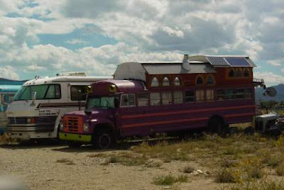 Customized bus in storage yard, Taos, New Mexico