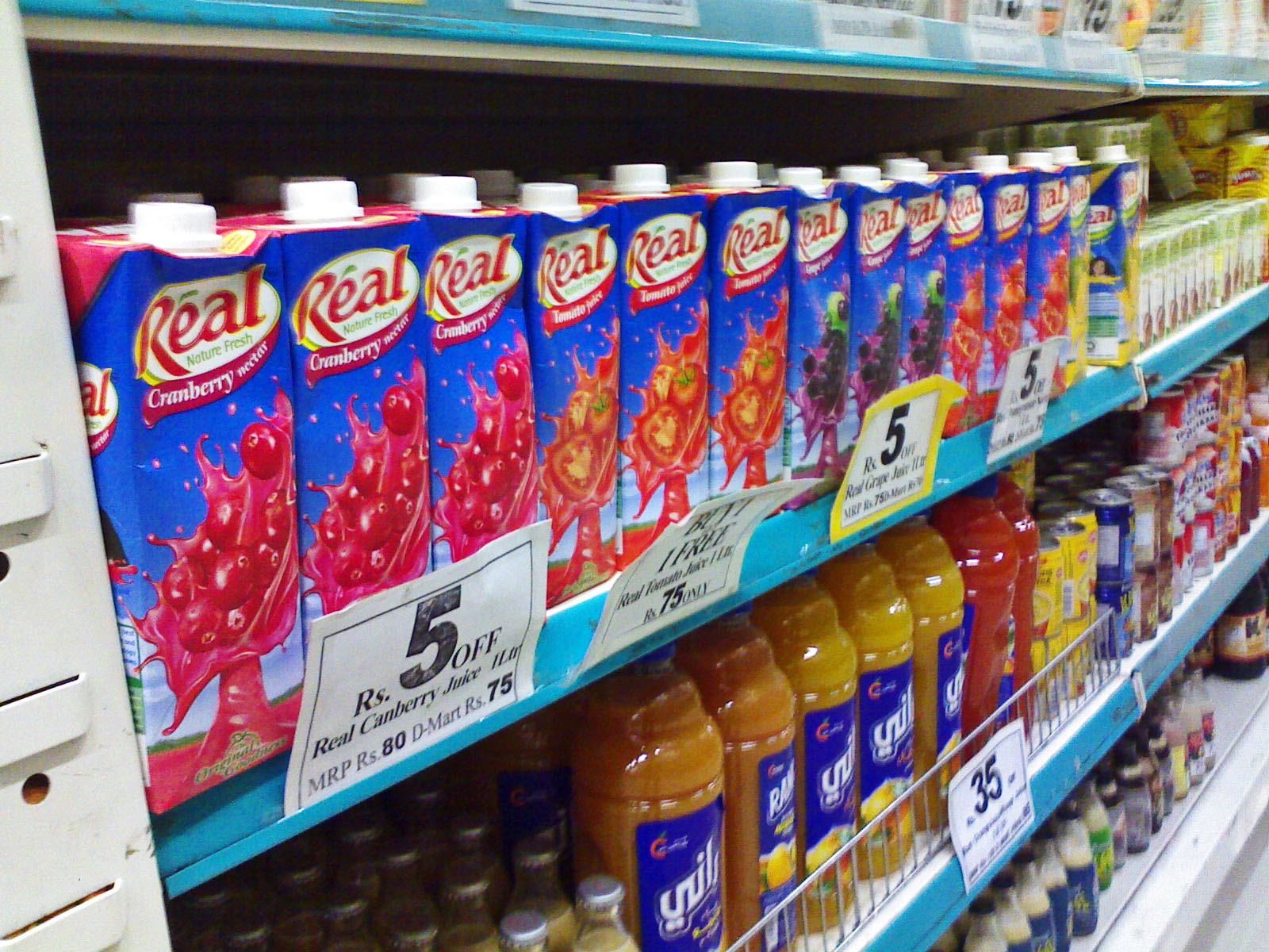 Stock Pictures Juices and Milk display at supermarkets in India