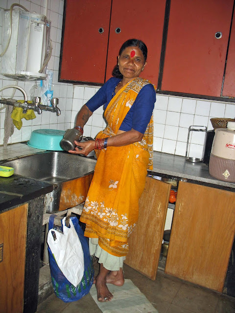 woman maid cleaning utensils