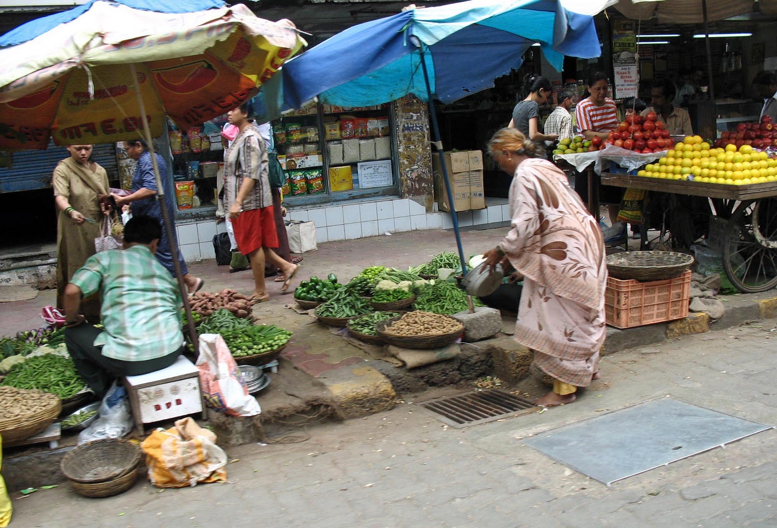 Stock Pictures Road side vendors in India blocking the pavements