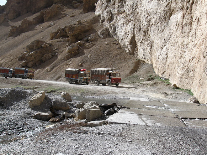 Convoy of Trucks on the Mountain Road