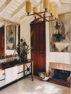 Bathroom with exposed beams, a chandelier, small fireplace, a console sink, large mirror and large piece of art