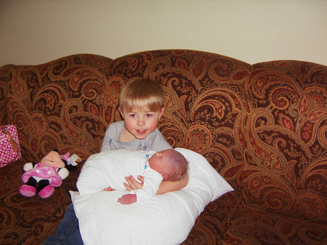 Spencer is hold his little sister