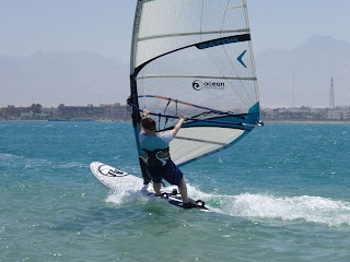 Candice windsurfing with style