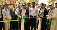 Dignitaries perform a ribbon cutting ceremony at Wasit province's Agricultural Union headquarters in al-Kut, Iraq, June 2. The ceremony marked the grand re-opening of the headquarters. (Photo by Multi-National Division-Central)