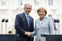 President George W. Bush and Germany's Chancellor Angela Merkel shake hands Wednesday at Schloss Meseberg in Meseberg, Germany. Bush publicly thanked the German people for their efforts in Afghanistan and Iraq. (White House photo by Eric Draper)