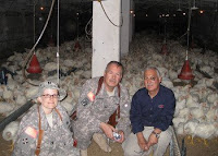 Capt. Suzanne Todd (left), pauses for a photo with Col. Lyle Jackson, a veterinary officer who serves with Multi-National Corps-Iraq, and an unidentified man at a poultry farm in Arbil in northern Iraq in October. Todd’s primary mission is to track veterinary and agriculture issues of the Iraqi people.