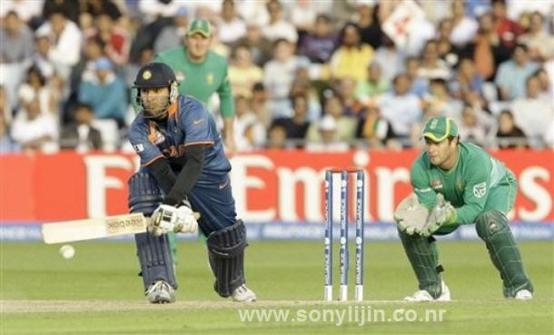 [India's+Yuvraj+Singh,+left,+hits+a+shot+watch+by+South+Africa+wicketkeeper+Mark+Boucher.jpg]