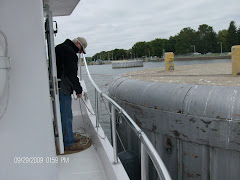 Tying to a 'cell' to wait for a big tow to make room for us in the lock. Another cell in background