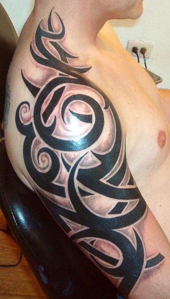 Tribal Back Tattoos Men. tribal tattoo on upper back. Tribal Back Tattoos Men.