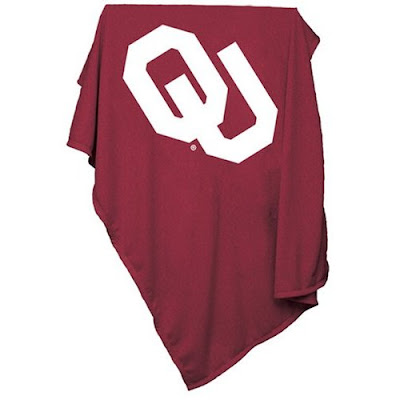 Crimson OU sweatshirt blanket with white writing.