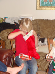 Drew opening his stocking from his Grandparents