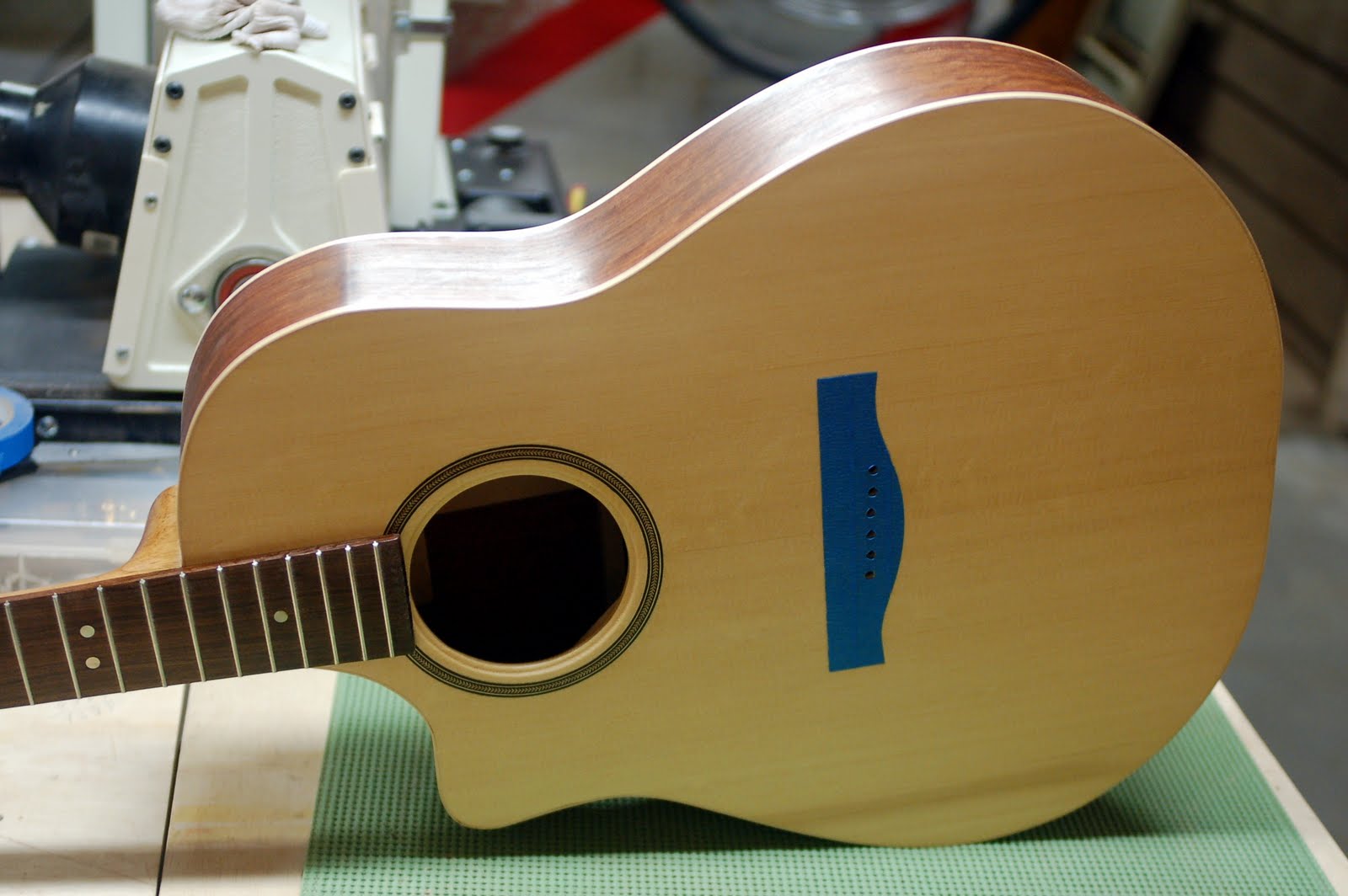 ThreeQuartersLeft French polishing the guitar
