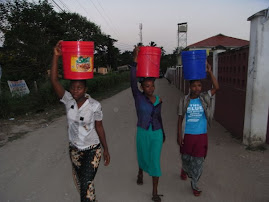 Its a girls job to fetch water.