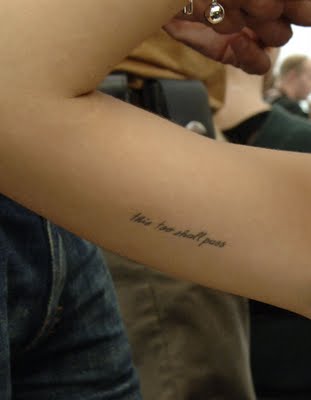 This Too Shall Pass on the inside of her upper right arm
