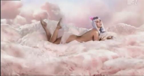 Singer Katy Perry shows her sweet flirty sexiness as she goes topless in a 