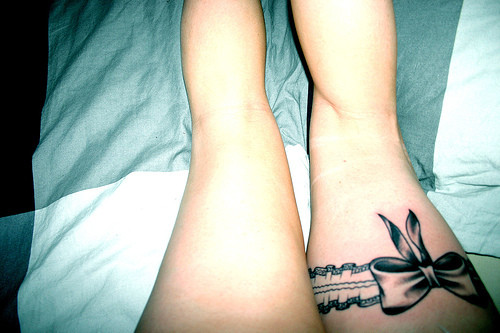 bow tattoo on ankle. ows tattoos pink ribbon
