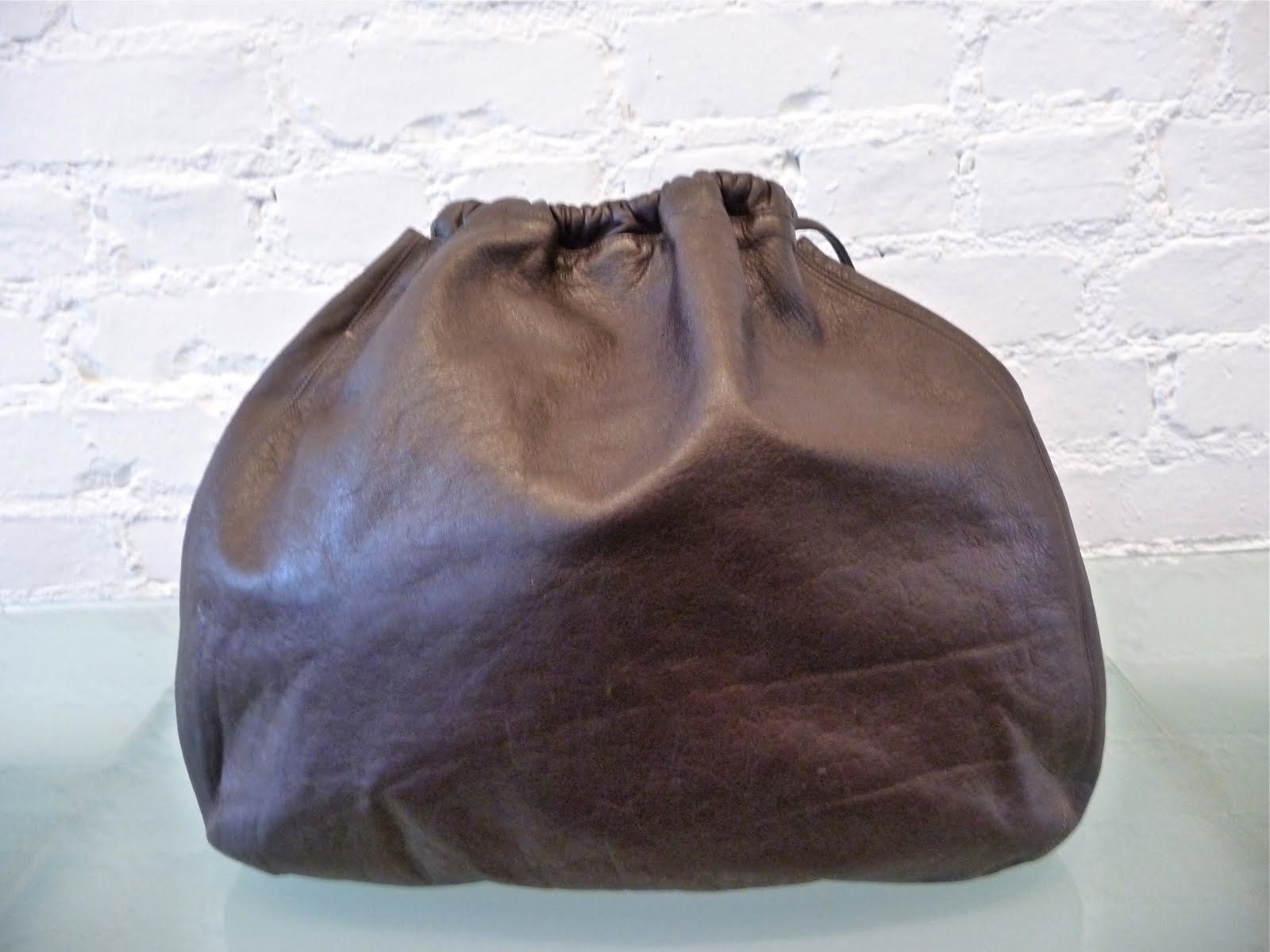 DECADES INC. "Over the shoulder boulder holder"