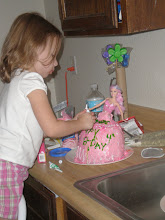Karli decorating her cake