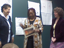 Recieving an award for completing the getting out of poverty class