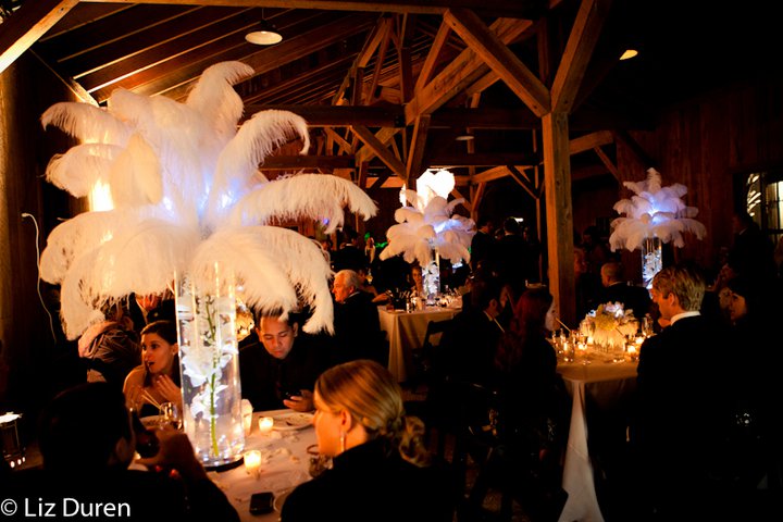  were topped with huge white feathers perfect for a New Year's wedding