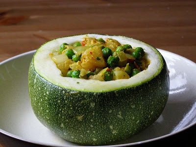 stuffed zucchini with curried potatoes and peas