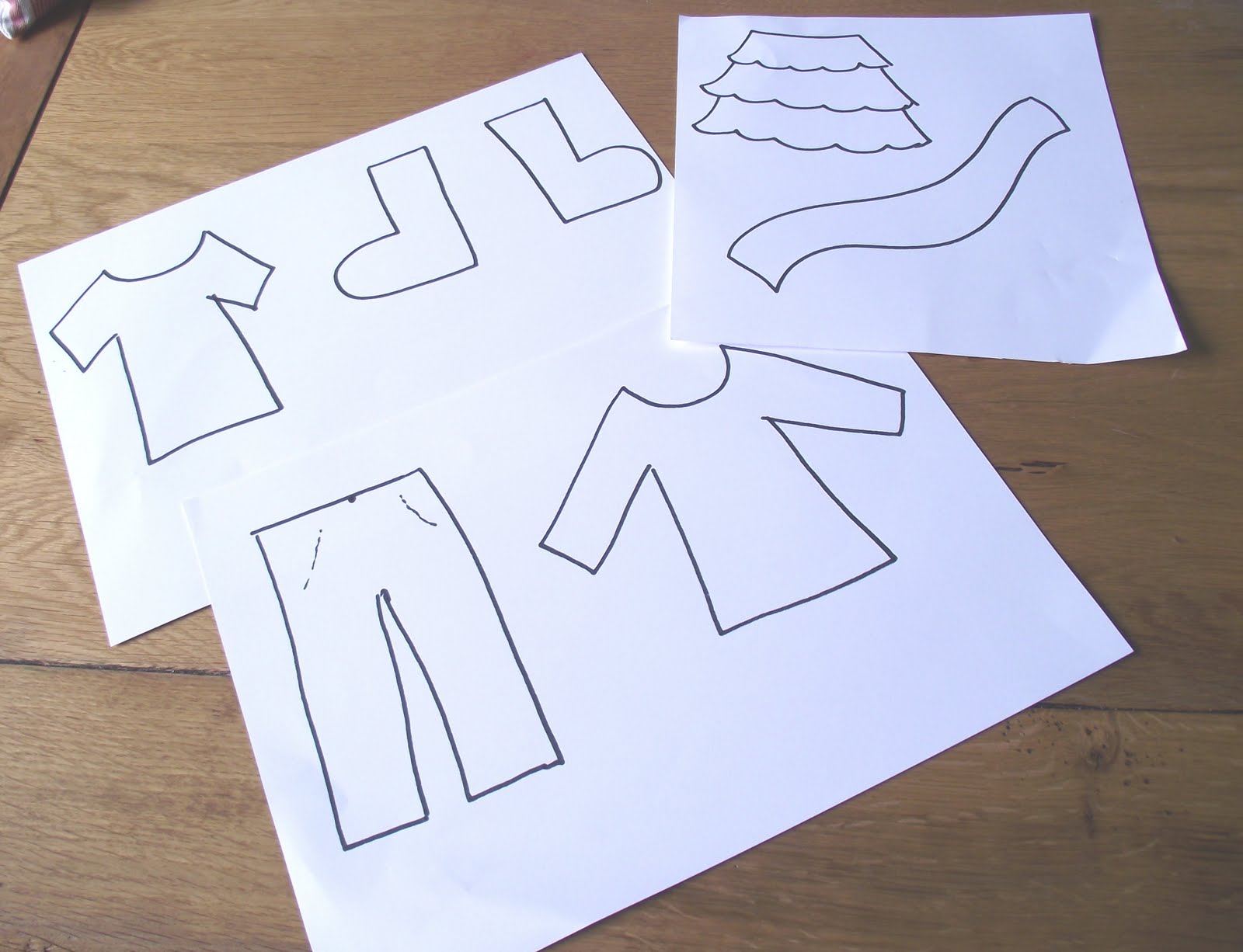 Two Little Seeds Making Paper Clothes for a Washing Line