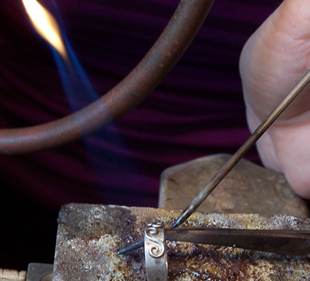 Each embellishment is soldered individually .
