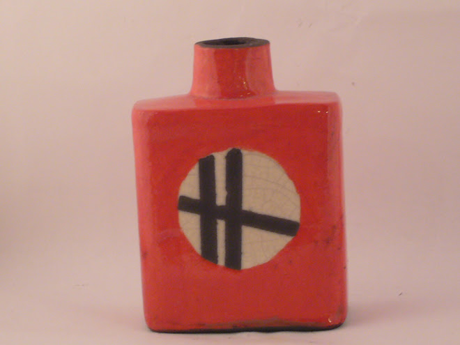 Small red raku bottle