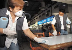 Workers Disinfect Food Tables