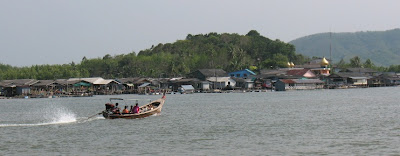 Long tail boat and stilted village, Phang Nga