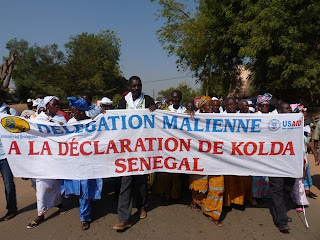 The delegation from Mali marches to the public declaration.