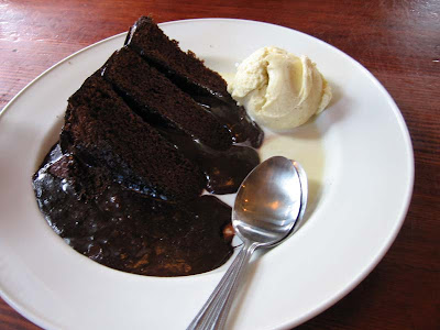 slice of hot chocolate fudge cake with a scoop of vanilla ice-cream. slice of hot chocolate fudge cake with a scoop of vanilla ice-cream.