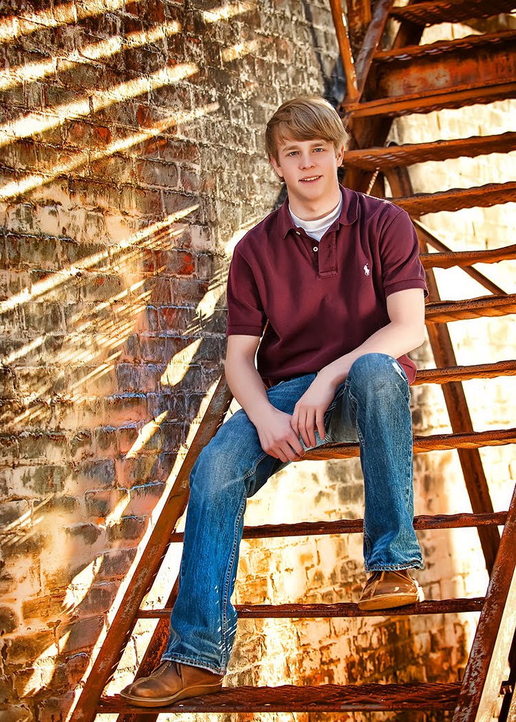 This senior braved the cold weather in short sleeves to have his senior portrait made!