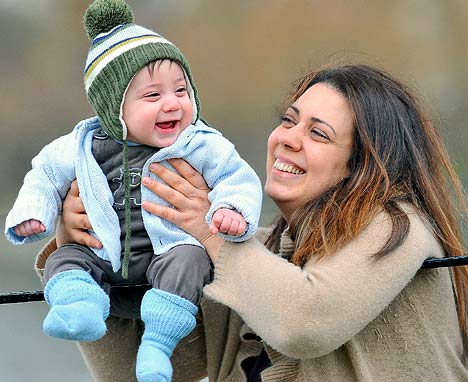 cute baby girl and mother laughing photo