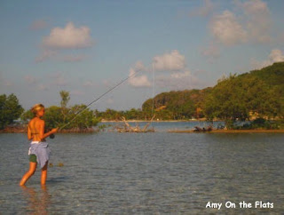 Photo of Amy casting on the flats