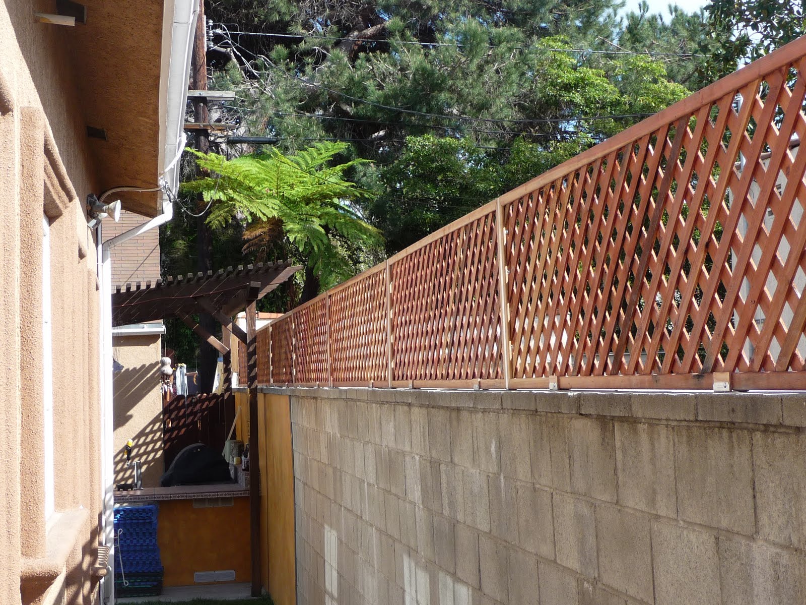 THB Construction Privacy Trellis Added to Cinder Block Wall