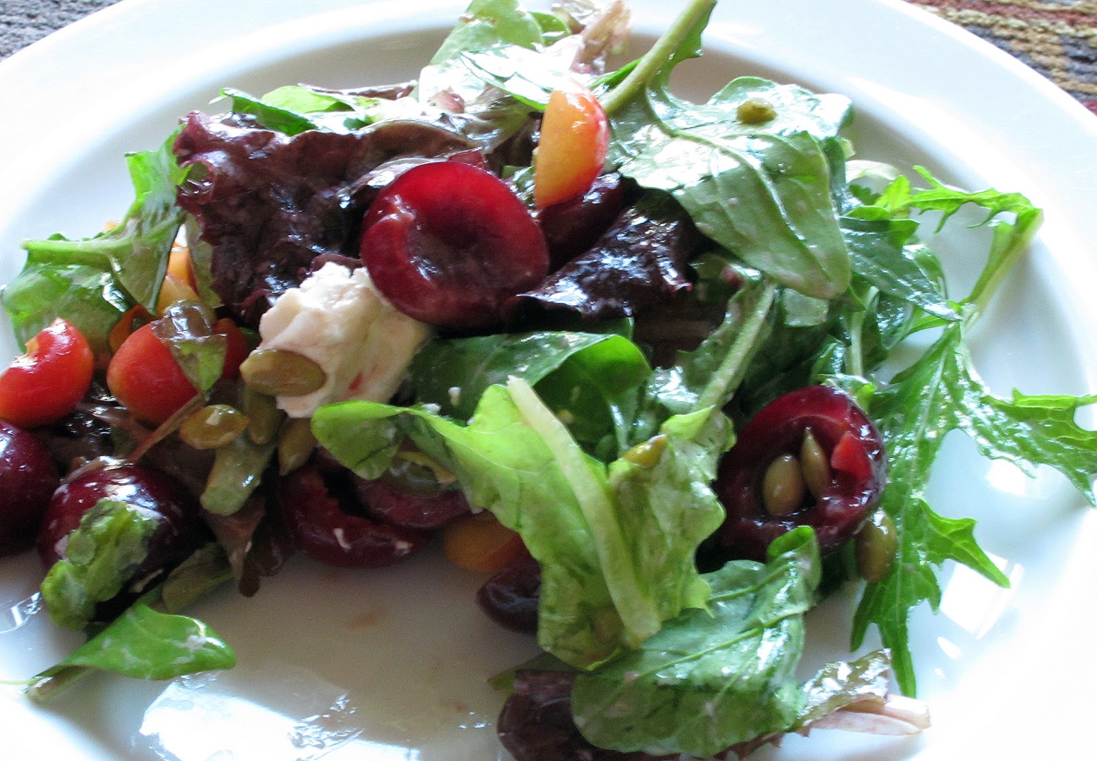 Spring salad with cherries and goat cheese