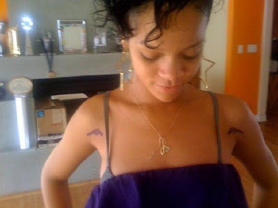 Rihanna's tattoos in his hand and ribs: Rihanna's New Ink
