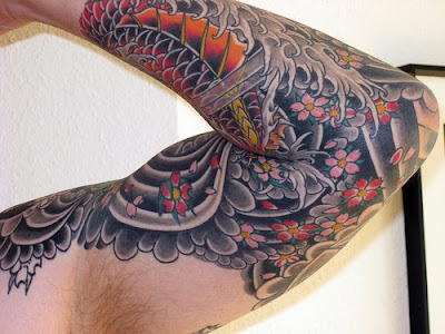 Koi fish are an ever well-liked theme for Japanese Sleeve Tattoo styles.