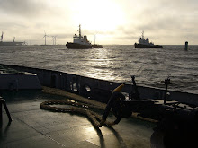 a fleet of tugs waiting the big to come