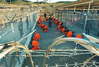 [01aaa-gitmo-orangesuits.jpg]