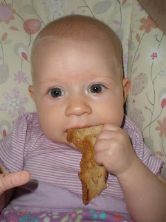 Baby eating toast