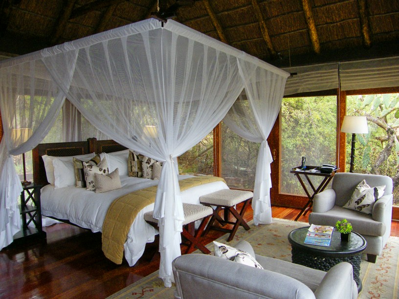 bedroom Gorgeous lodge bedroom decor ideas Gorgeous-lodge-bedroom-with-wooden-flooring-wooden-double-bed-with-white-curtains-gray-amrchairs-and-bedroom-furniture