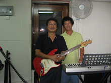 Mr Quek on Rhythm guitar and Eric Tan on the keyboard