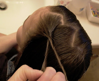 Little Girl S Hairstyles Two Top Twist Braids With Stuffed Bun