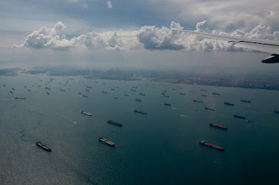 Hundreds of container ships sat idle off the coast of Singapore last year.